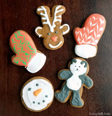 Gingerbread men are a Christmas must have! These one have a nice buttery cookie base and all of the spices are likely to already be in your spice cabinet. They will make converts of those who don't think they like these spicy little fellas! German gingerbread cookies decorated as rudolph the red nose reindeer, mittens, a panda and a snowman face