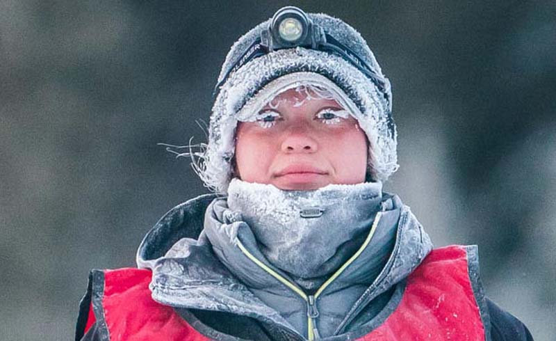 Musher Leanne Bergen, of Ontario, nears the finish line in the 120-mile mid-distance race.