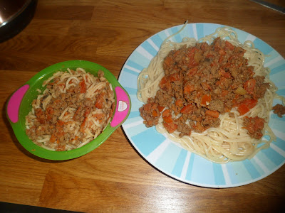 Adult and baby portions of homemade spaghetti bolognese