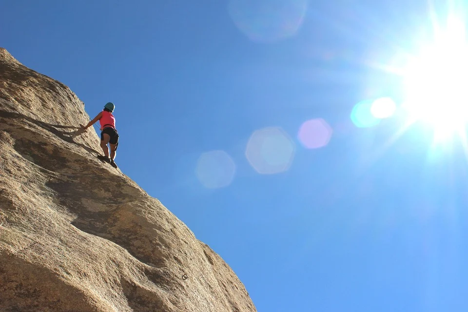 Man climbing sloping mountain Man climbing sloping mountain