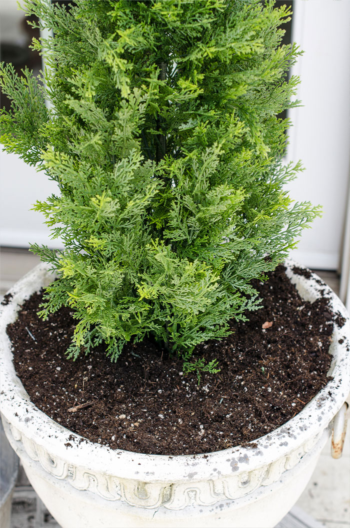 Faux shrubs and bushes are a great alternative to the real thing when planted in pots and containers for your porch.  Learn where to find these plants and how to make them look as real as possible to easily enhance your home's curb appeal.  |  www.andersonandgrant.com