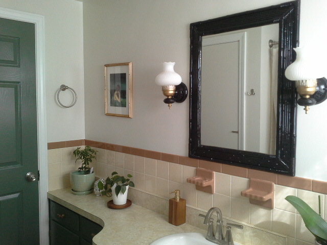 Vintage bathroom makeover Vintage bathroom makeover green cabinet door black bamboo mirror
