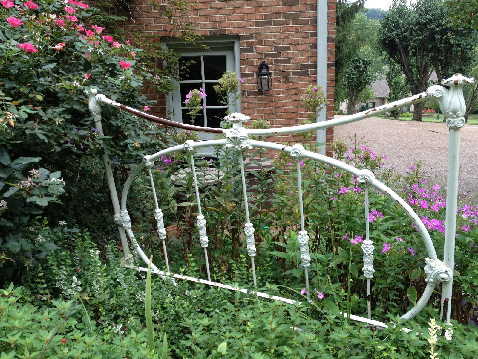 Eccentric Little Beauties Iron Headboard in the Garden update