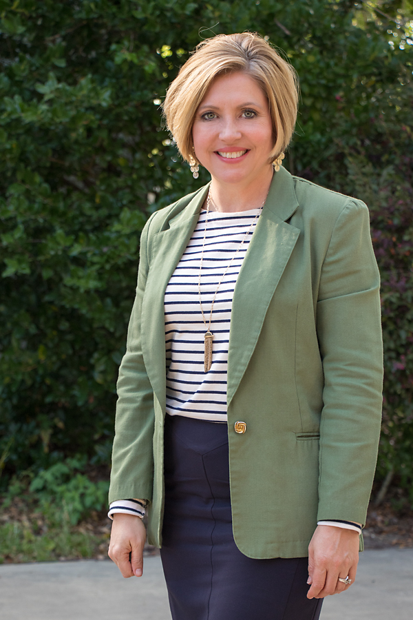 navy striped top and tassel necklace