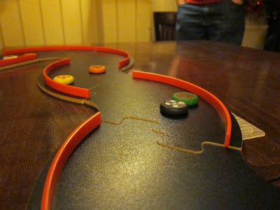 Pitch Car - A close up of the track and cars
