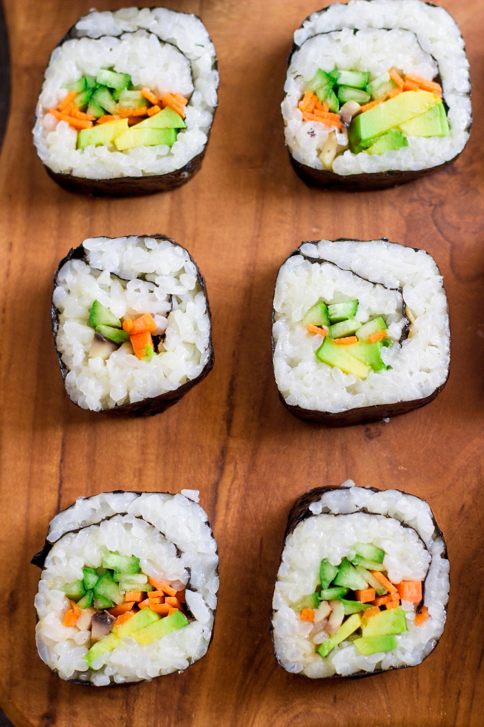 Avocado, cucumber, carrot vegan maki sushi roll