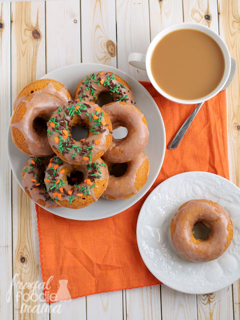 Moist cake donuts are packed with pumpkin and then drizzled in a cinnamon glaze in these delicious Cinnamon Glazed Pumpkin Buttermilk Donuts.