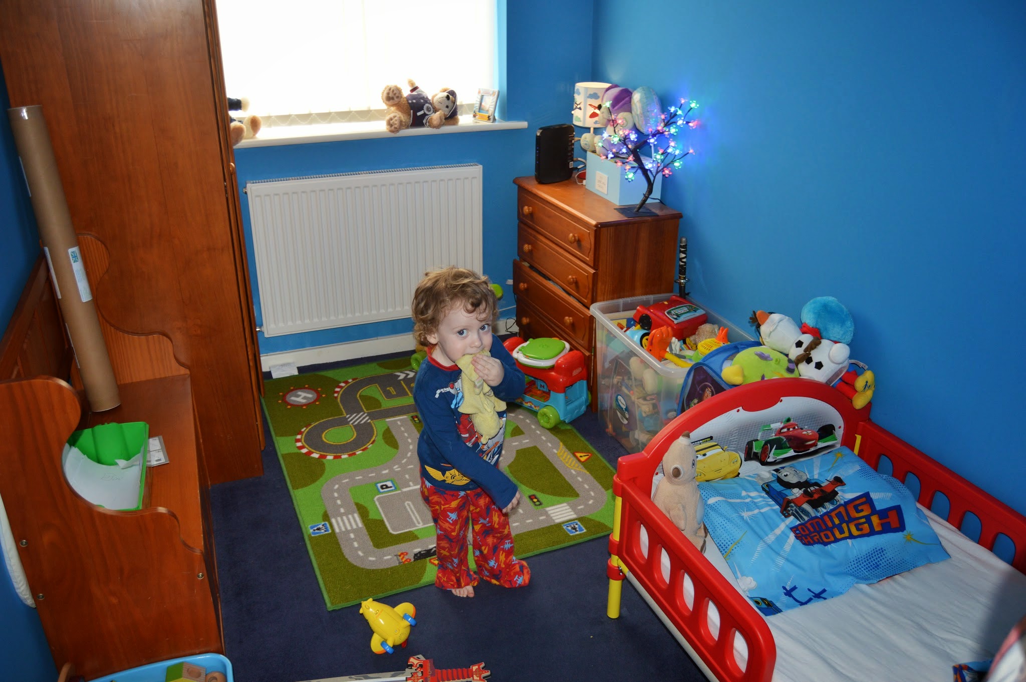 toddler in his bedroom toddler in his bedroom