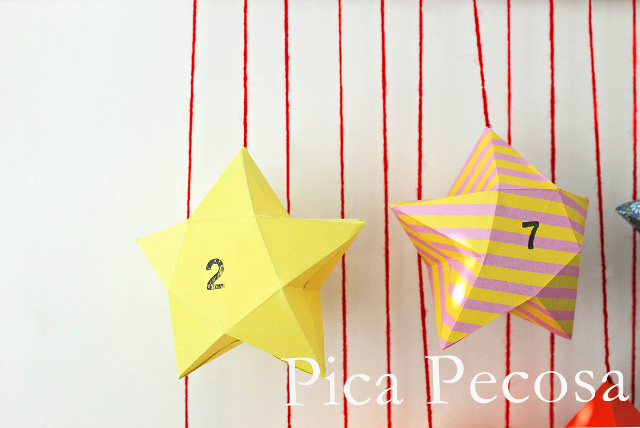 calendario-adviento-diy-trozo-madera-pinzas-ropa-adornadas-washi-tape-cajas-papel-forma-estrella