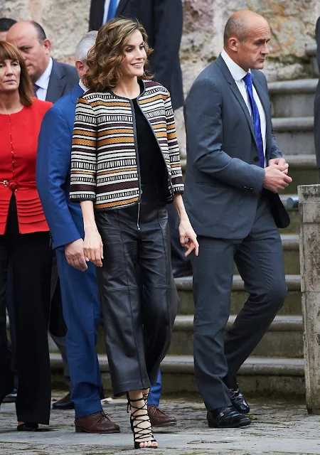 Queen Letizia of Spain attends the opening of the 11th International Seminar on Language and Journalism. Letizia wore Uterque Coat, Leather Trouser and Sandals