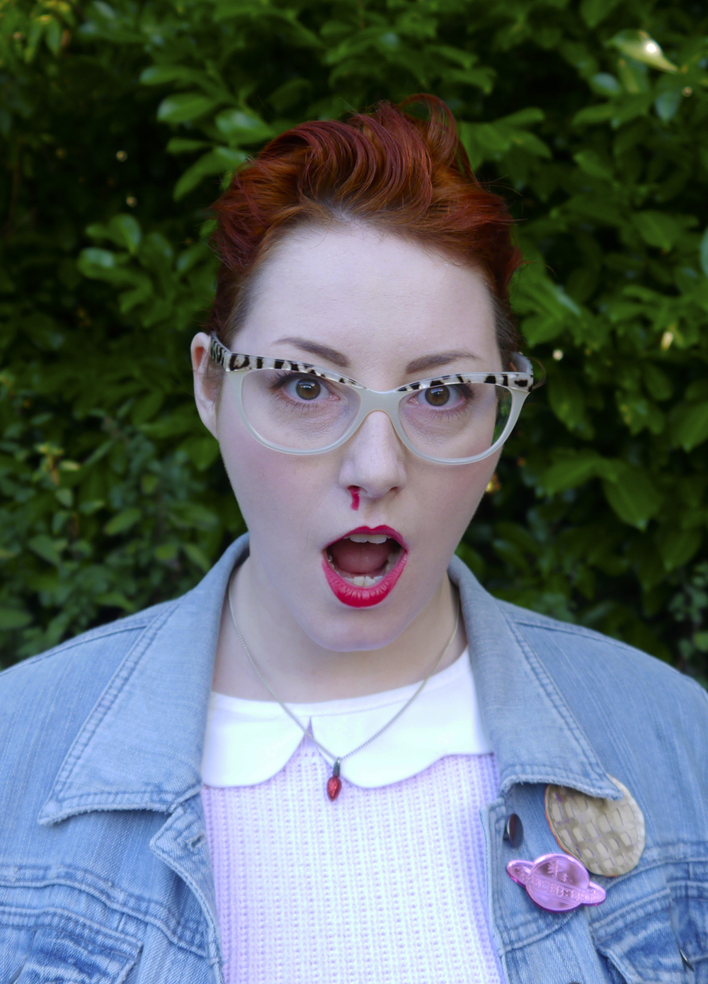 Unlikely Style Icon: Eleven - Stranger Things unlikely style icon, costume inspiration, Stranger Things, Eleven from Stranger Things, Stranger Things inspired outfit, Spex Pistols glasses, Cheap Frills christmas light necklace, denim jacket, pink outfit, Eat Me do socks , Wear Eponymous skirt, Eggo brooch, bonnie bling brooch, Lucky Dip club brooch