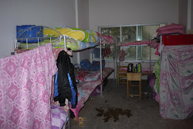 dormitory room with 9 beds