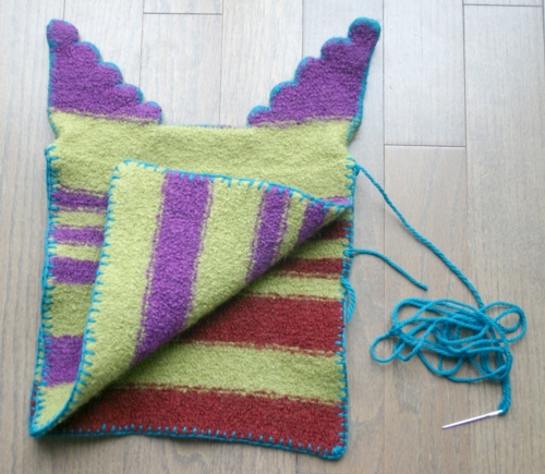 Blanket stitch both sides.