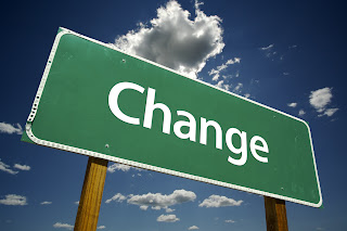 A street sign that says Change on it