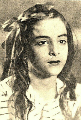 You can make it out the name of this girl! Yes that is Nargis. You can make it out the name of this girl! Yes that is Nargis.