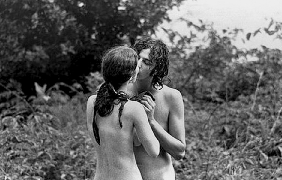 Naked hippie girl doesn't even move while man is.