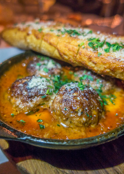 Prime Beef Meatballs with cheese curds and garlic bread at Maple & Ash in Chicago Prime Beef Meatballs with cheese curds and garlic bread at Maple & Ash in Chicago