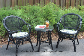 Black wicker chairs and side table