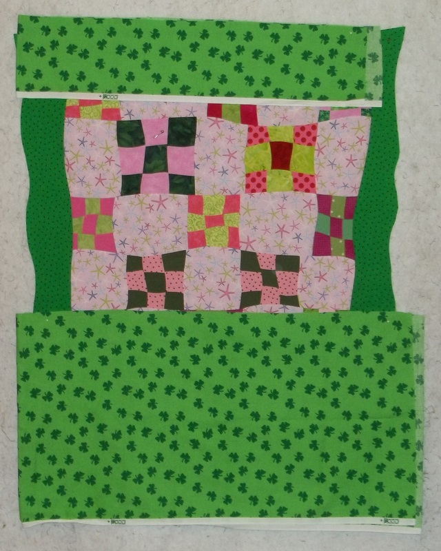 Traveling Quilter Wavy edges cut on border, quilt back pieced together