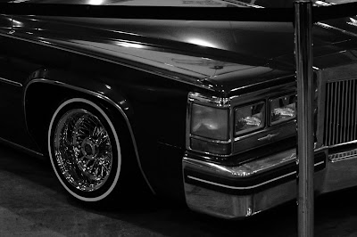 Exhibitor booth featuring tattoo art and merchandise