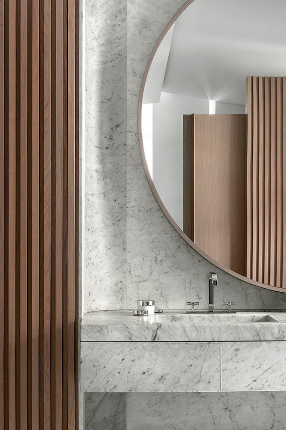Eclectic bathroom design with marble and oak by François Champsaur in a Parisian apartment