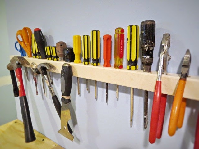 tools in 2x2 hanging on wall