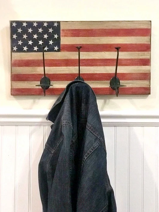 American Flag coat rack with extra large hooks for hanging coats or towels. 