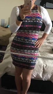 woman in long mirror in cute dress 