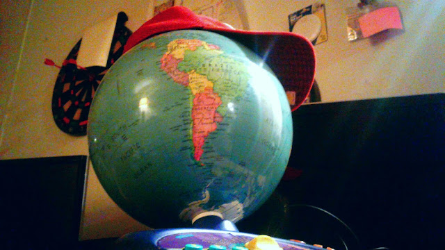 Mario hat on globe of Earth cap