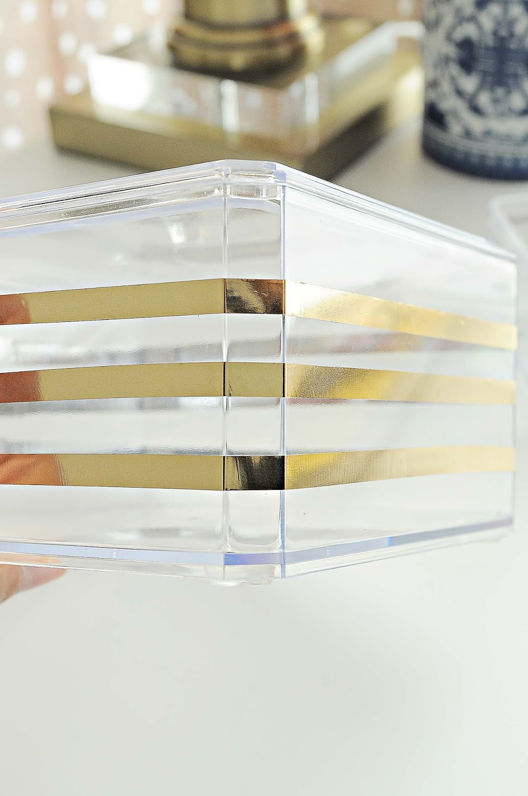 DIY gold and lucite dollar store storage organizer- great for makeup and beauty supplies.