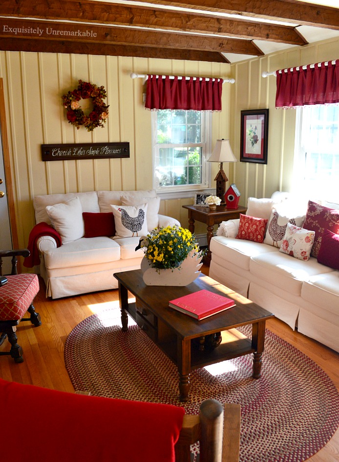 Cottage Style Living Room With Red Accents