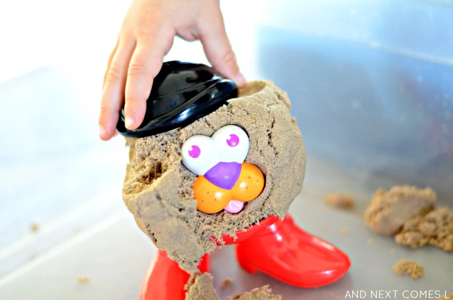 Fun way to play with kinetic sand using potato head pieces