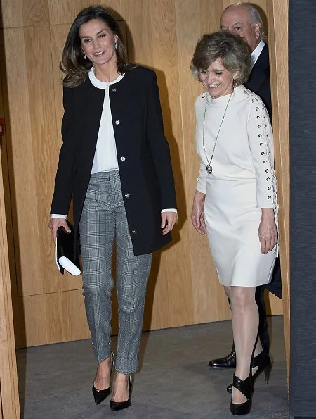 Queen Letizia wore Hugo Boss silk blouse, Caolina Herrera jacket and, Mango Prince of Wales trousers and pearl earrings