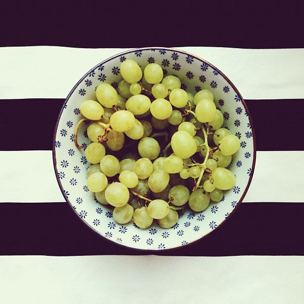 grapes in a bowl, on black stripes