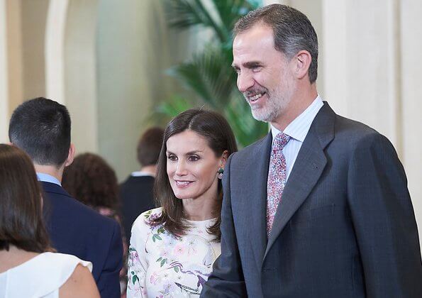 Queen Letizia wore Asos Design Tall midi dress with pretty floral and bird embroidery, and Magrit pink pumps and Magrit pink bag