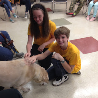 summer day campers visiting with guide dog Jessie