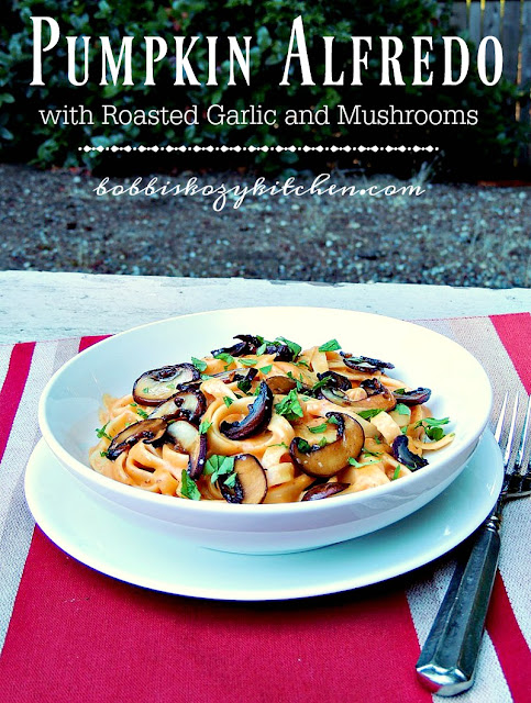 Pumpkin Alfredo with Roasted Garlic and Tomatoes - The earthy flavor of pumpkin and mushrooms, mixed with the sweetness of roasted garlic, and the creaminess of Alfredo sauce, makes this pasta dish a must make for sure From www.bobbiskozykitchen.com
