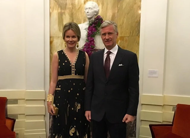 Queen Mathilde at Queen Elisabeth Piano Competition. Queen Mathilde wears Diane Von Furstenberg - DVF Vivanette Embroidered Tulle Goddess Gown. A Bag with a Story Clutch, TIKLI JEWELRY Gold Drop Earrings and Bracelet