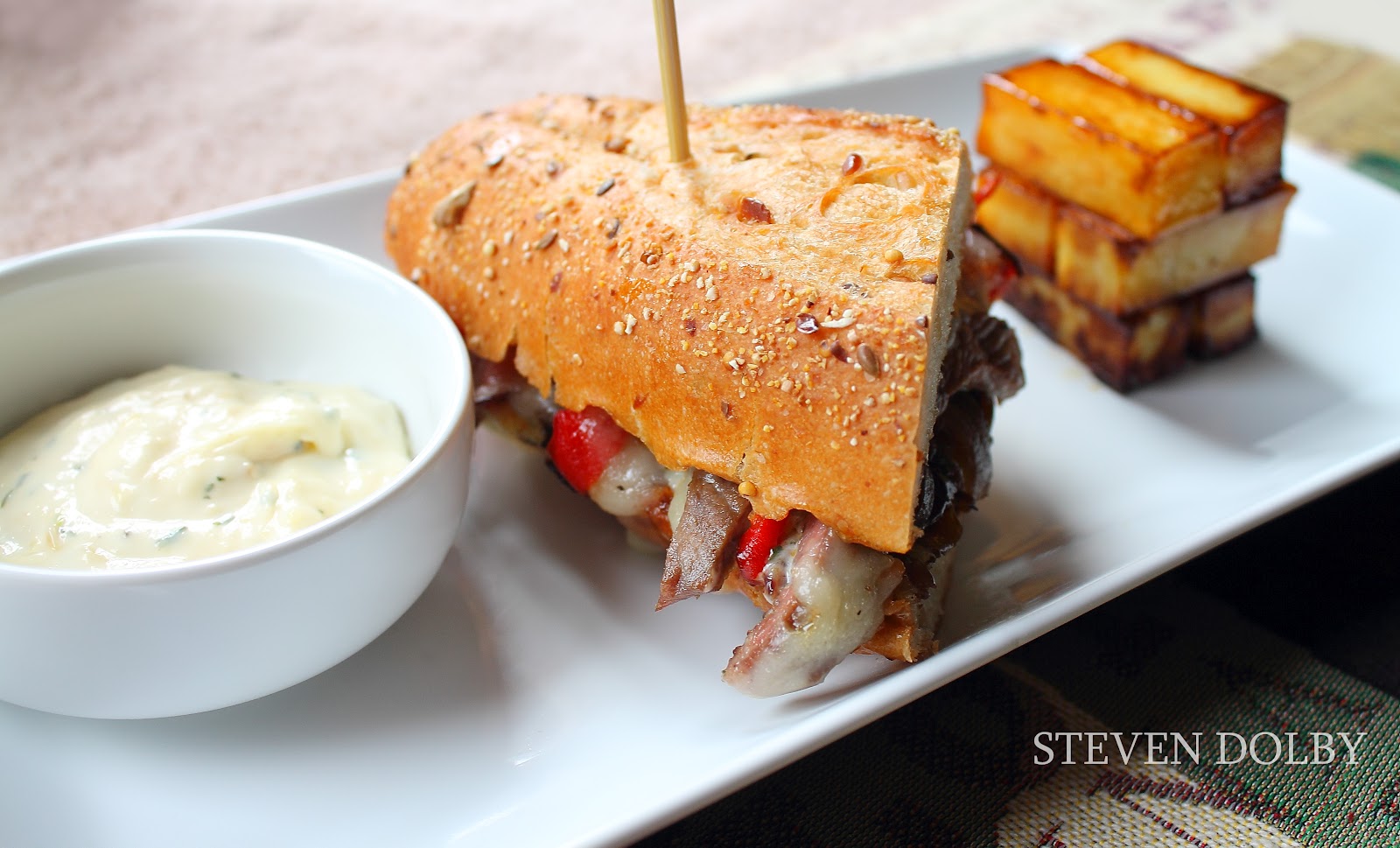 Cheese Steak Sandwich with Roasted Garlic, Rosemary Aïoli by Steven Dolby