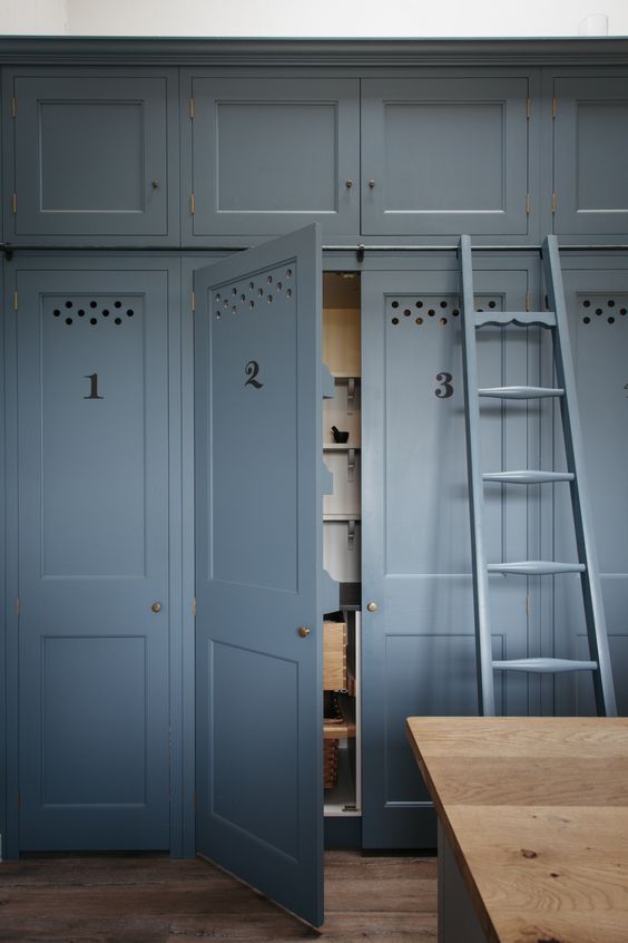 Blue Shaker style pantry doors and kitchen cabinets in an English Country kitchen by #PlainEnglish
