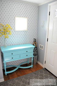 Small entry with pops of turquoise and yellow with geometric patterned wallpaper :: OrganizingMadeFun.com