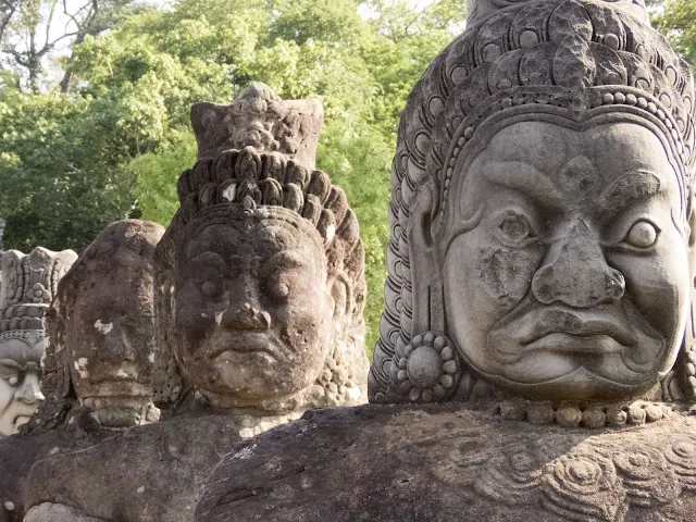 Demons lining the entrance to Angkor Thom City in Cambodia