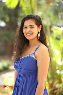 Actress Prasanna Stills in Blue Short Dress at Inkenti Nuvve Cheppu Movie Platinum Disc Function  0017