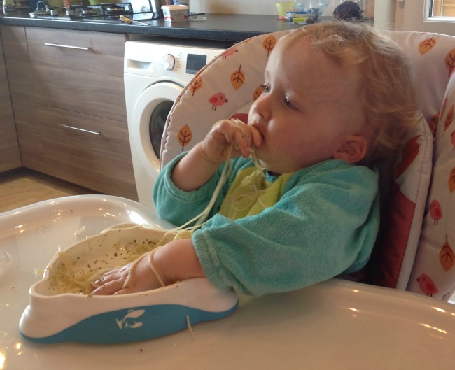 Picture of toddler eating spagetti