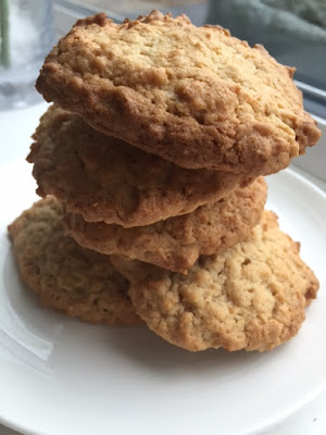 Coconut Oat Cookies piled up on a plate