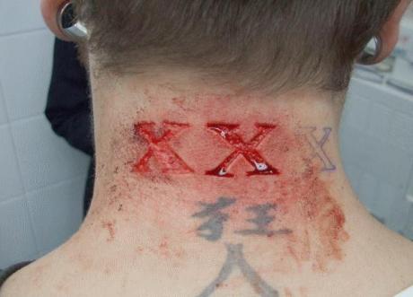 Triple X Tattoo 105