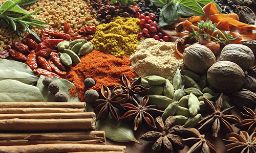 A collage of different foods and spices. 