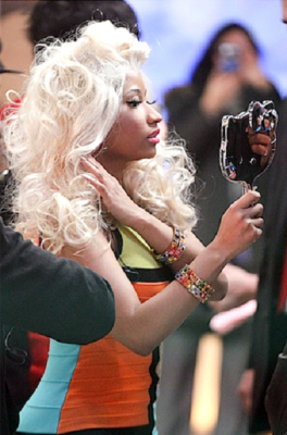Nicki Minaj holding cute Hello Kitty hand held looking glass mirror