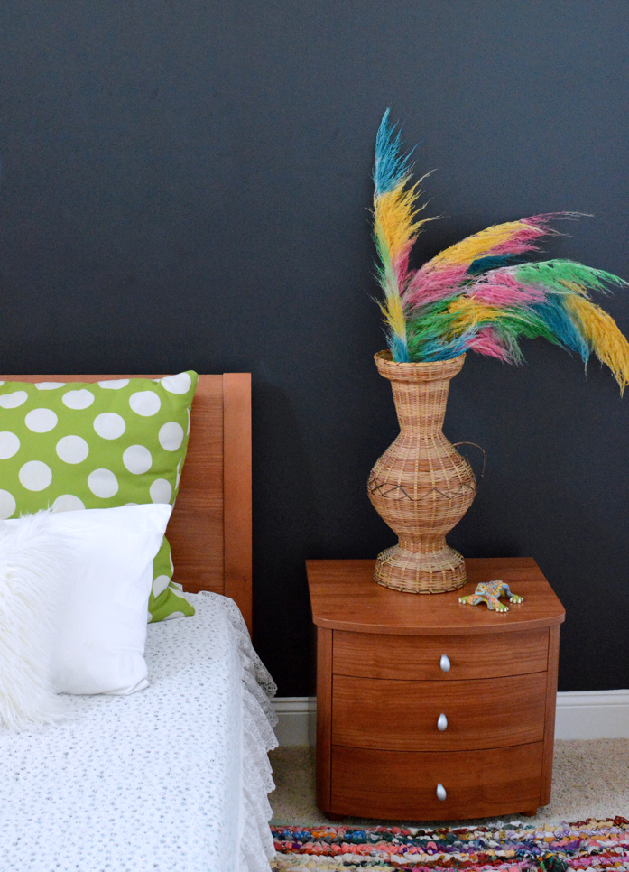 Spray painted pampas grass placed in this lovely vase add beautiful color to this side table-perfect for spring: designaddictmom
