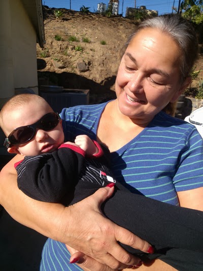 Reef Indy is getting use to wearing his Baby Banz Sunglasses 